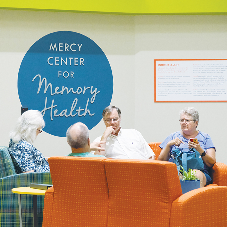 People talking at Mercy Center.