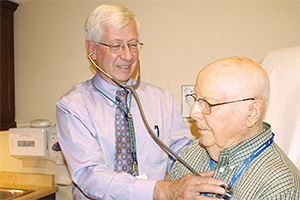 Physician examines patient