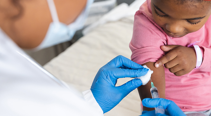 Child receiving a vaccination.