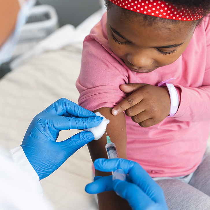 Child receiving a vaccination.