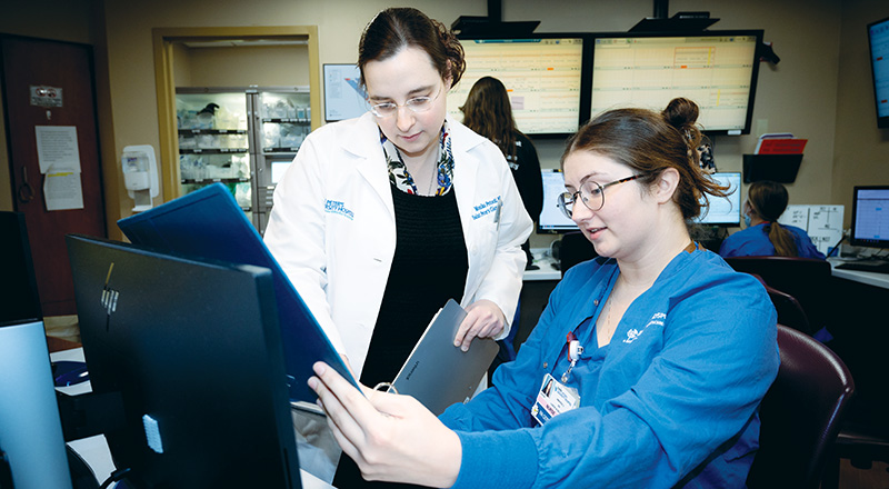 Dr. Monika Potocki, left, an obstetrician-gynecologist, talks with labor and delivery unit nurse Amanda Joyce