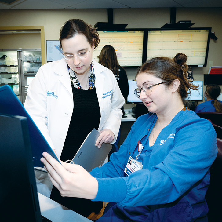 Dr. Monika Potocki, left, an obstetrician-gynecologist, talks with labor and delivery unit nurse Amanda Joyce