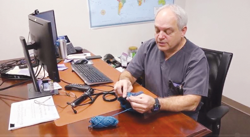 An advanced practice nurse with Mercy Clinic Primary Care — Hope Campus in Fort Smith, Arkansas, knits caps to give away to patients.