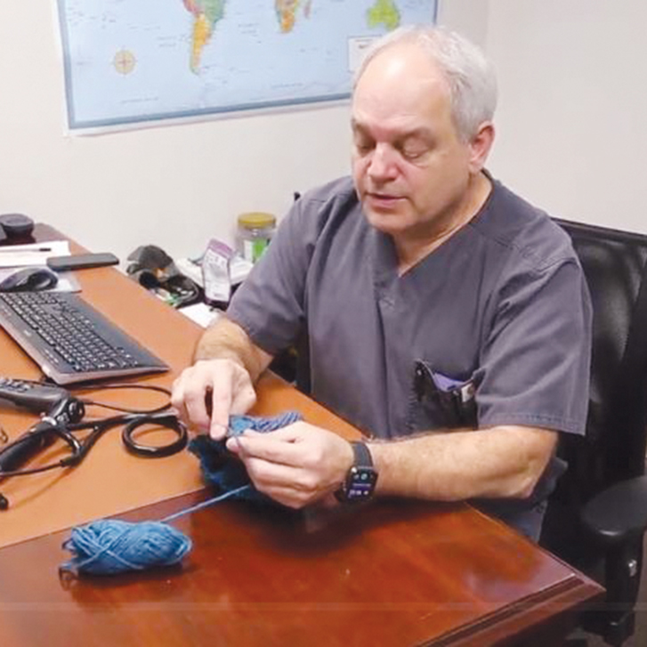 An advanced practice nurse with Mercy Clinic Primary Care — Hope Campus in Fort Smith, Arkansas, knits caps to give away to patients.