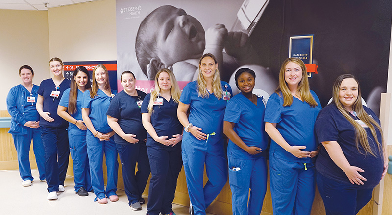 These are 10 of the 14 clinicians who are part of a baby boom at St. Joseph’s Health Hospital in Syracuse, New York.